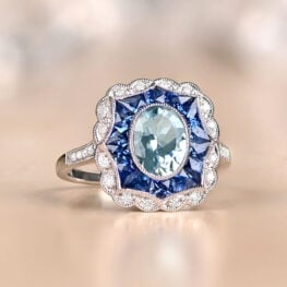 engagement ring featuring diamonds, sapphires and aquamarine