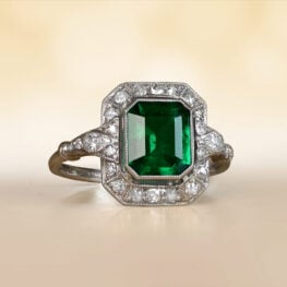 Emerald Cut Emerald and Diamond Halo Ring Artistic Phone