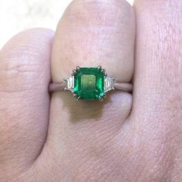 1.58 carat emerald engagement ring with diamonds on each side
