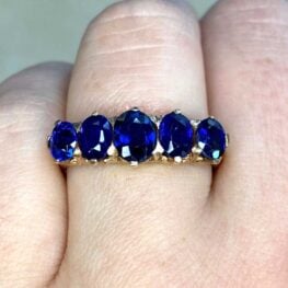 Somerset wedding ring featuring oval sapphires set in prongs