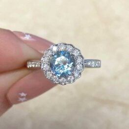 0.75 carat aquamarine engagement ring with diamonds along the shoulders