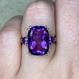 amethyst engagement ring 14k yellow gold mounting featuring a scroll motif on the gallery