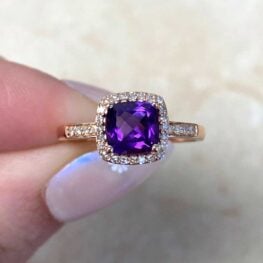 amethyst engagement ring surrounded by a halo of diamonds