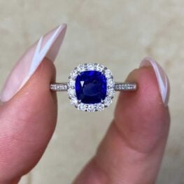 harvard cocktail ring featuring a sapphire with diamonds surrounding it 15038
