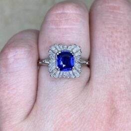 vintage varena ballerina style engagement ring featuring a 1.06 carat cushion cut sapphire set in prong