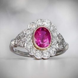 Oval Cut Ruby and Diamond Floral Halo Ring Artistic