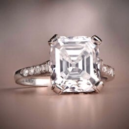 stunning vintage ring that centers a lively emerald cut diamond SB1054-Artistic-B